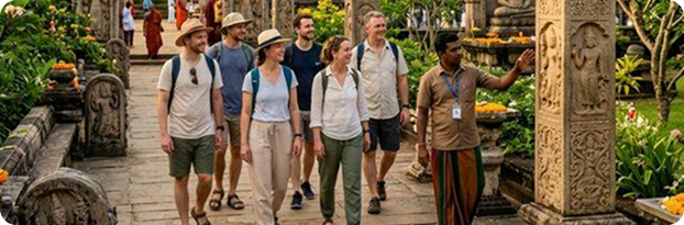 Travellers exploring an ancient Sri Lankan temple heritage site with a local expert guide